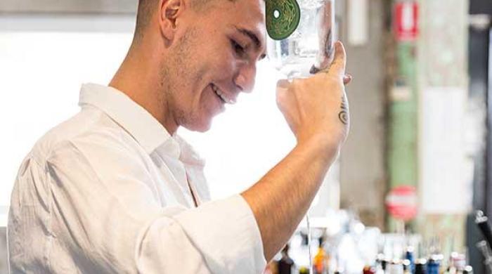 Young man pouring a drink